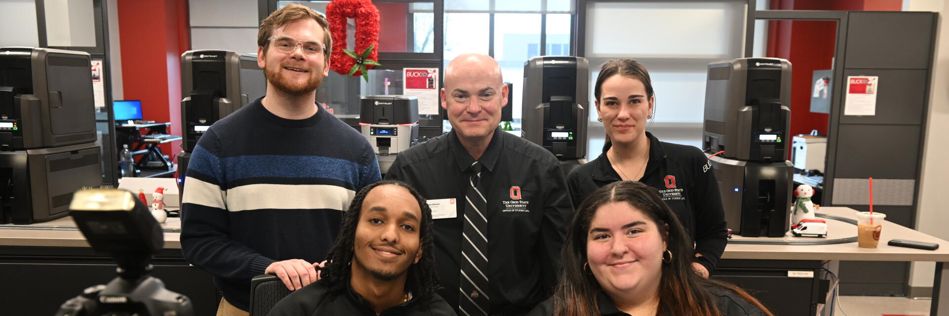 BuckID Card Services staff members standing behind service counter